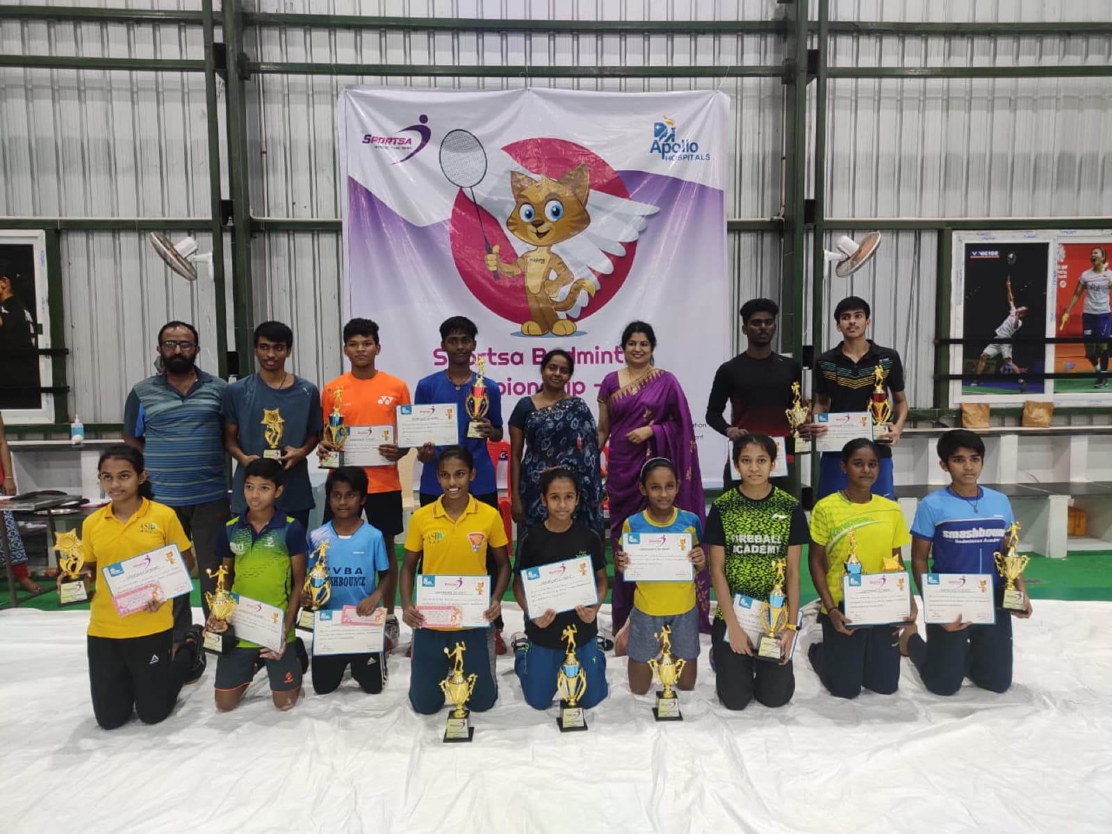 A group of students celebrating at a Sportsa sports event