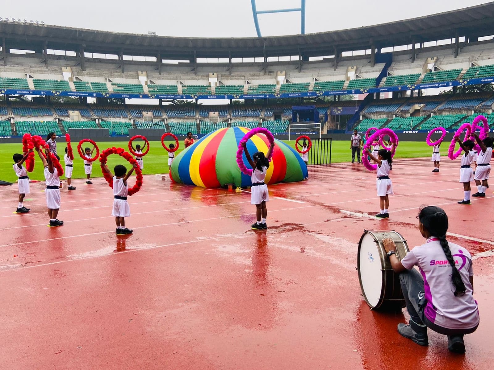 A Sportsa trainer demonstrating a drill to school students